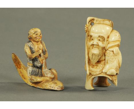 A Japanese earthenware figure of Kashima restraining Namazu, late 19th century, the God represented as a fisherman dressed in