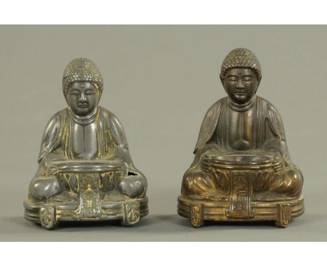 Two Japanese hollow cast alloy Buddhas, early 20th century, each seated with an offering bowl in their lap, decorated with lo