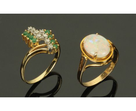 Two 14 ct gold rings, opal and diamond and emerald.  