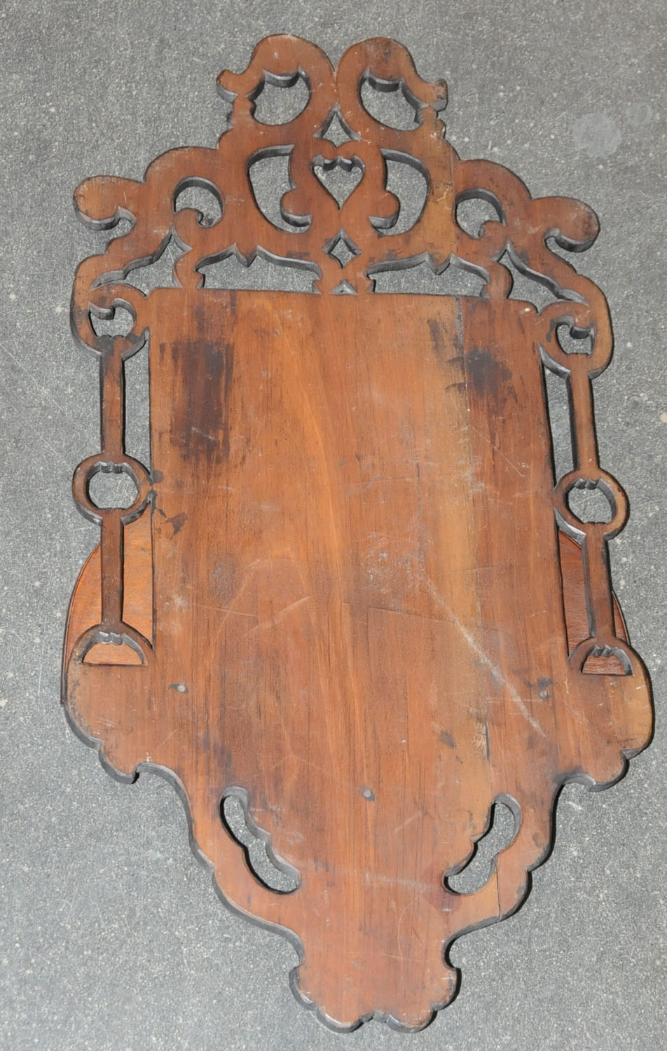 A set of three Japanese carved and stained wood wall brackets, late