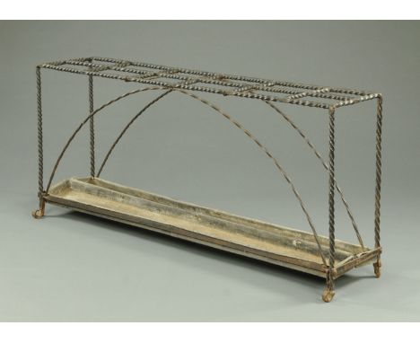 A large country house wrought iron rectangular stick stand.  Length 174 cm, depth 35 cm, height 76 cm. 