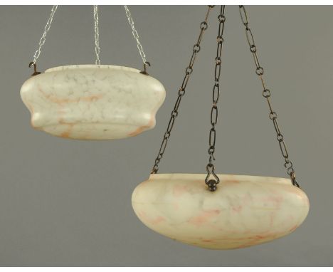 Two mottled glass ceiling light shades, circa 1920/30, the domed bodies with marbled effect decorated in white and red, each 