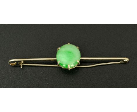 A silver coloured metal bar brooch, set with a single jade stone.  18 mm x 15 mm. 