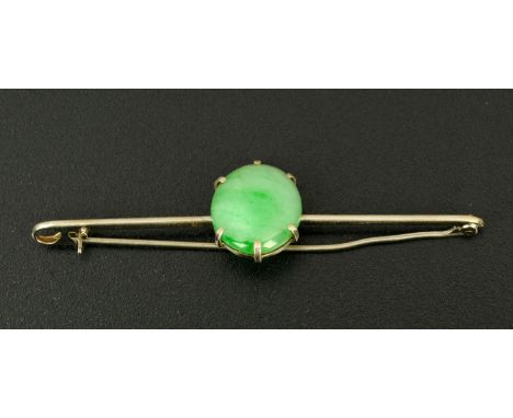 A silver coloured metal bar brooch, set with a single jade stone.  18 mm x 15 mm. 