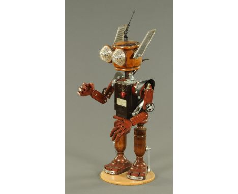 A Steam Punk inspired figure of a robot, the head constructed from an oak tea caddy, a smokers pipe for the neck, the body co