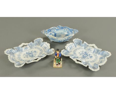 A pair of New Stone china transfer printed dishes, length 30 cm, a Spode pierced basket and a figurine of a seated boy holdin