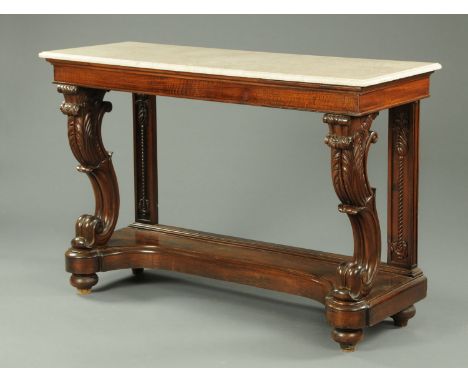 A 19th century mahogany console table, with later marble top, mirrored back, scroll front supports and raised on bun feet wit