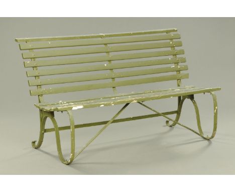 A painted wooden and wrought iron garden bench.  Length 144 cm. 