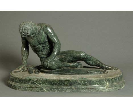 After the Antique, a carved serpentine marble sculpture, "The Dying Gaul", 19th century, his unsheathed sword and scabbard be