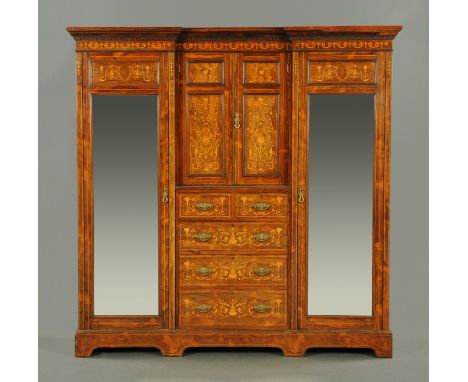 A good quality Edwardian inlaid rosewood wardrobe, with detachable moulded inverted breakfront dentil cornice above a series 