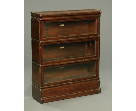 An oak three tier sectional bookcase, Globe-Wernicke.  Width 87 cm.  CONDITION REPORT: The bookcase is in structurally good c