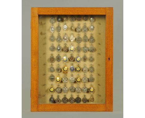 A collection of sixty three medallions, awarded to Cliff Sandham for various cycling pursuits, to include 94 centuries in one