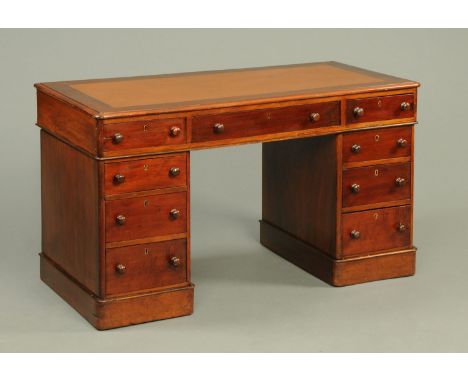 A Victorian mahogany pedestal desk, with brown leatherette writing surface, rounded corners, three frieze drawers and three f