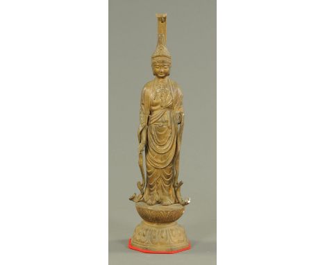 A gilt metal figure of Guanyin, 20th century, dressed in robes, standing on a double lotus base, height 50 cm (brackets, excl
