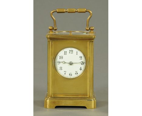 A French brass cased carriage clock, late 19th century, the enamel dial with Arabic numerals, with eight day movement and rep