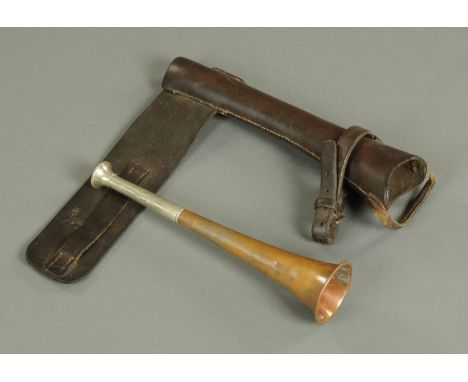 A copper and nickel plated hunting horn, early 20th century, with brass seam, and with leather case for mounting to a saddle,
