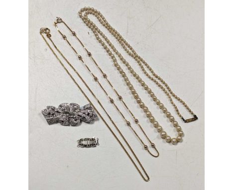 two gold chains, paste brooch, paste clasp and an imitation pearl necklace