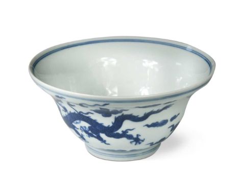 A Chinese blue and white dragon bowl,  of ogee shape, painted to the interior with a sky dragon, the exterior wall with two f