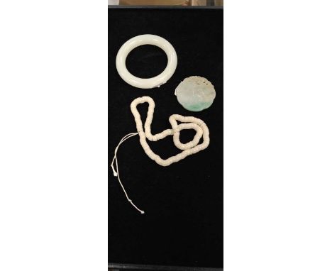 A Chinese jade pendant, 20th century carved with two playful boys, shou roundel, and crane, 5.4cm wide: A white stone plain b