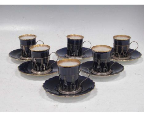 A set of six silver mounted Aynsley porcelain coffee cans and saucers circa 1912  with royal blue glaze, in George V silver g