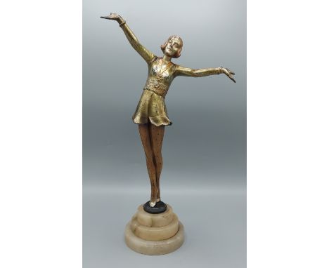 An Art Deco patinated metal figure in the form of a dancing girl, 37cms tall 
