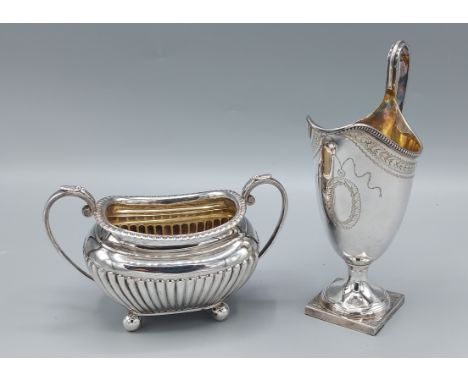 A London silver pedestal cream jug together with a Sheffield silver two handled sucrier, 10ozs 