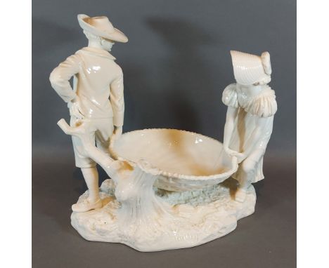 A Royal Worcester Hadley group depicting two figures with a large basket, 27cms tall 