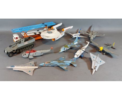 A Dinky Toys USS Enterprise together with other model vehicles and model aeroplanes 