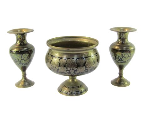 An Indian brass and black enamel pedestal bowl, decorated with foliate motifs, 20cm high, together with a pair of vases, 23cm