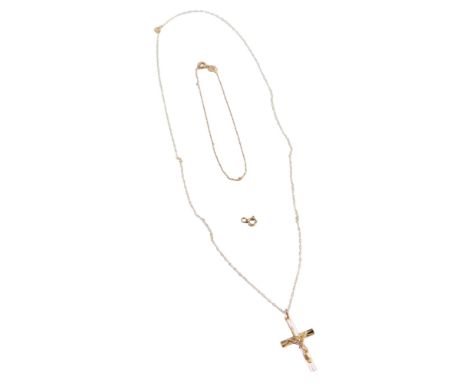 A 9ct gold crucifix pendant, on a fine link chain, the pendant 3cm high, the chain 44cm long, and a fine link bracelet, 12cm 