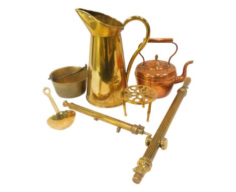 A group of copper and brass ware, to include a brass ewer, 37cm high, ladle, rose sprayers, brass preserve pan, trivet, and a