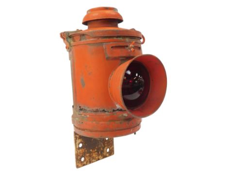 Railway Interest. A red metal crossing gate lamp, with L shaped wall bracket, the lamp 33cm high. 