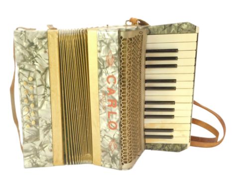A Carlo Marazini piano accordion, with leather strap, 31cm wide. 