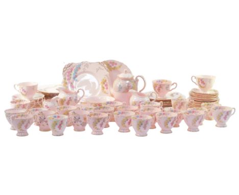 A Tuscan porcelain part tea and coffee service, decorated with flowers against a pink ground, gilt heightened, to include a c