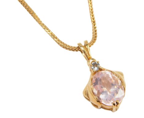 A pendant and chain, the pendant set with cz and pink topaz, 2cm high, on a fancy link neck chain, 16cm long, yellow metal st