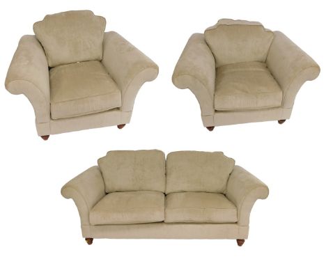 A modern cream upholstered two seater sofa, 210cm wide, together with two armchairs, each 116cm wide. 