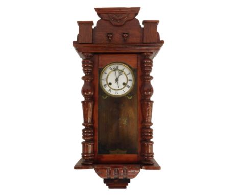 A 19thC mahogany Vienna wall clock, with turned columns supports and astragal glazed door, on a white enamel dial with Roman 