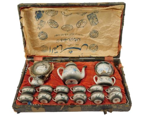 A Japanese eggshell porcelain coffee service, comprising a coffee pot, twelve cups and saucers, sucrier and cream jug, cased,