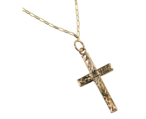 A 9ct gold crucifix pendant and chain, the crucifix pendant of scroll decoration, on a fine box link neck chain, 54cm long, 2