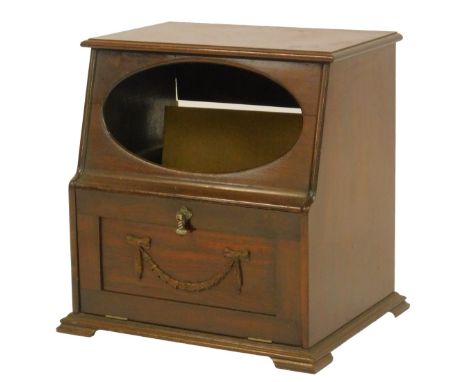 A late 19thC mahogany table organ case, with an oval recess to front, and lower fall with bow and swag decoration, on a mould