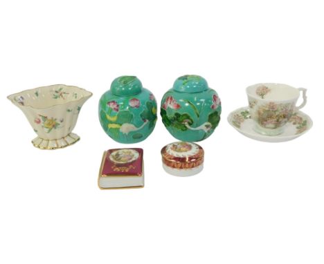 A group of porcelain, comprising a Clarice Cliff for Newport pottery vase, painted with flowers, 8cm high, a Royal Doulton Su