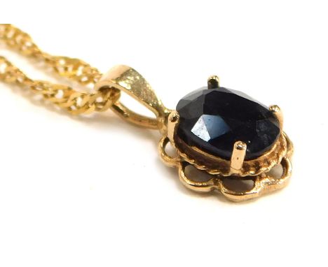 A 9ct gold and sapphire single stone pendant, on a fine curb link neck chain, with bolt ring clasp, 2.9g. 