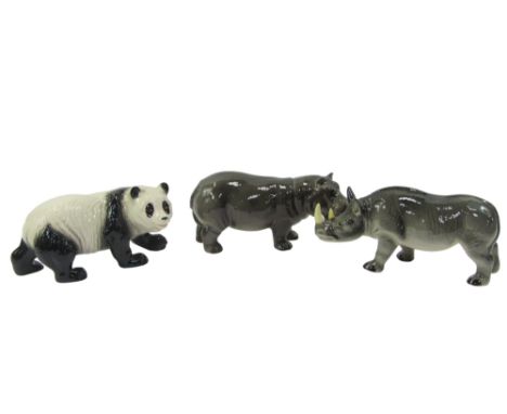 Three items of Melba ware pottery, comprising a rhino, 12.5cm high, giant panda and hippo.