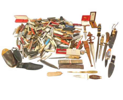 A group of penknives, daggers, knife sharpeners, ebony handle knife sharpener, razor blades, etc. (1 box)