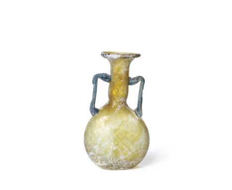  A Roman yellow-amber glass ribbed lentoid flask with blue handles Circa 3rd-4th Century A.D.14.5cm high Footnotes:Provenance