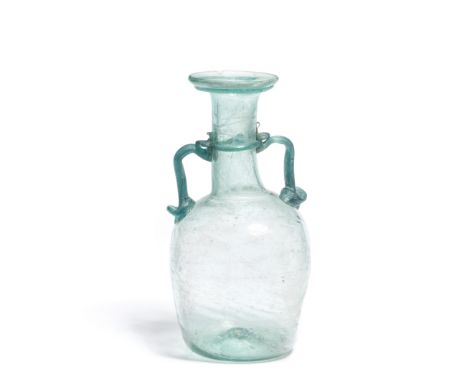  A Roman turquoise glass two-handled flask Circa 3rd-4th Century A.D.14.6cm high Footnotes:Provenance:with Gil Chaya, Biblica