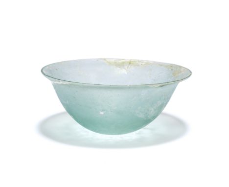  A small Hellenistic pale blue glass bowl Circa 2nd-1st Century B.C.10.7cm diam.Footnotes:Provenance: Anonymous sale; Christi