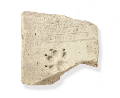  A Neo-Assyrian cuneiform clay brick with paw print Circa early 1st Millennium B.C.19.5cm x 18cmFootnotes:Provenance:Collecti