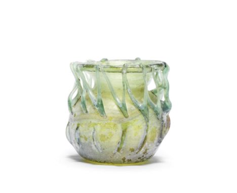  A Roman ribbed glass jar with zigzag trail Circa late 3rd-4th Century A.D.9.3cm high Footnotes:Provenance:Anonymous sale; Ch