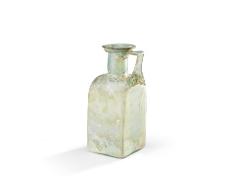  A Roman blue-green glass square bottle Circa late 1st-2nd Century A.D.16.8cm high Footnotes:Provenance:W. Wollek collection,